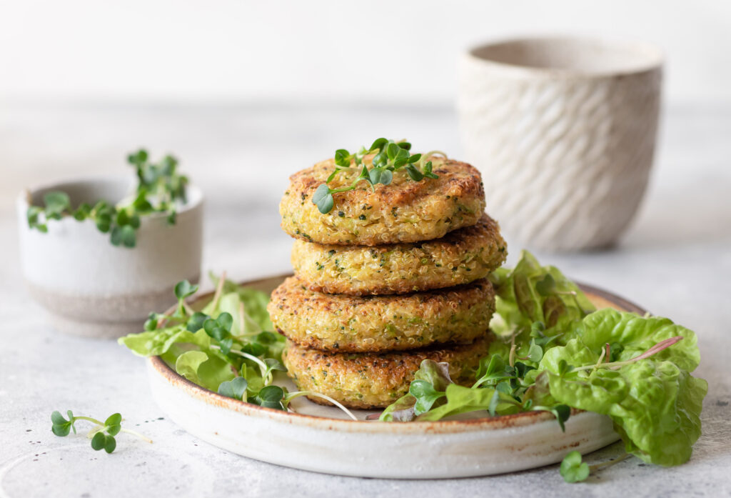 Quinoa burgers served with lettuce and microgreens. Tasty vegan food. close-up